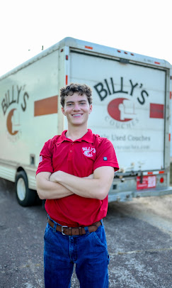 Billy of Billy's Couches standing in front of his delivery truck